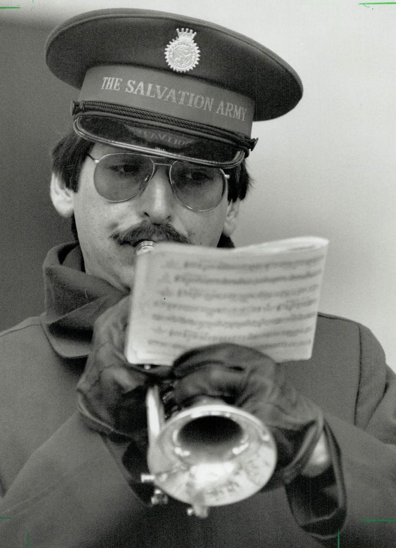 David Tutton: Trainee plays a carol for passersby on Bloor St