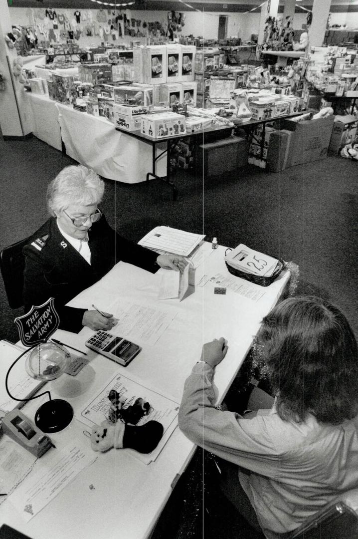 Tough Task: Salvation Army home league secretary Margaret Nelson Interviews a woman to determine whether her family needs help this Christmas