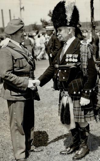 At yesterday's parade (right), the veterans paraded by towns