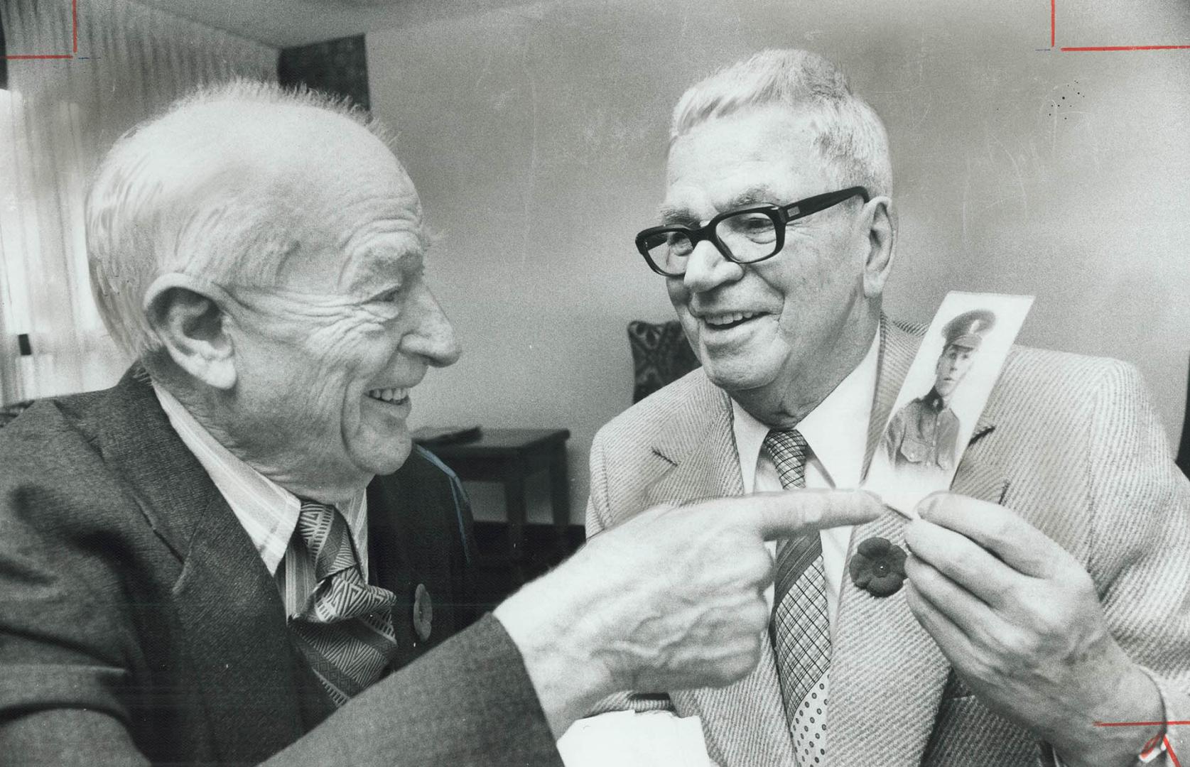 Paul McColl, left, pokes a bit of fun at army photo of his old World War I buddy Horace Wakefield