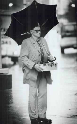 Standing Firm, World War II veteran William Kondrat, 74, selling Remembrance Day popples on Queen St