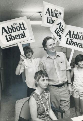 The winner is Mississauga, Oakville lawyer Tony Abbott, a Liberal, and his wife are surrounded by campaign signs last night at his victory celebration(...)