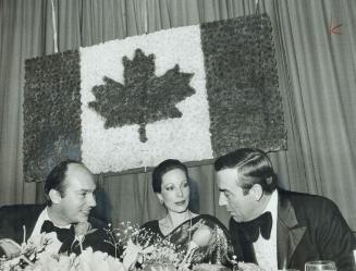 The Aga Khan, left, his wife, the Begum Aga Khan, and Norm Cafik, MP for Ontario riding dine at Harbour Castle Convention Centre last night