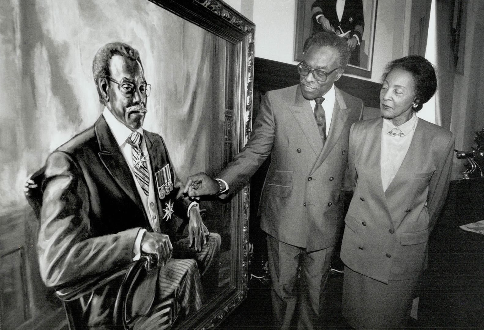 Retiring Lincoln Alexander, Ontario's lieutenant-governor for the last six years, shows his new portrait to wife Yvonne at Queen's Park. The painting,(...)