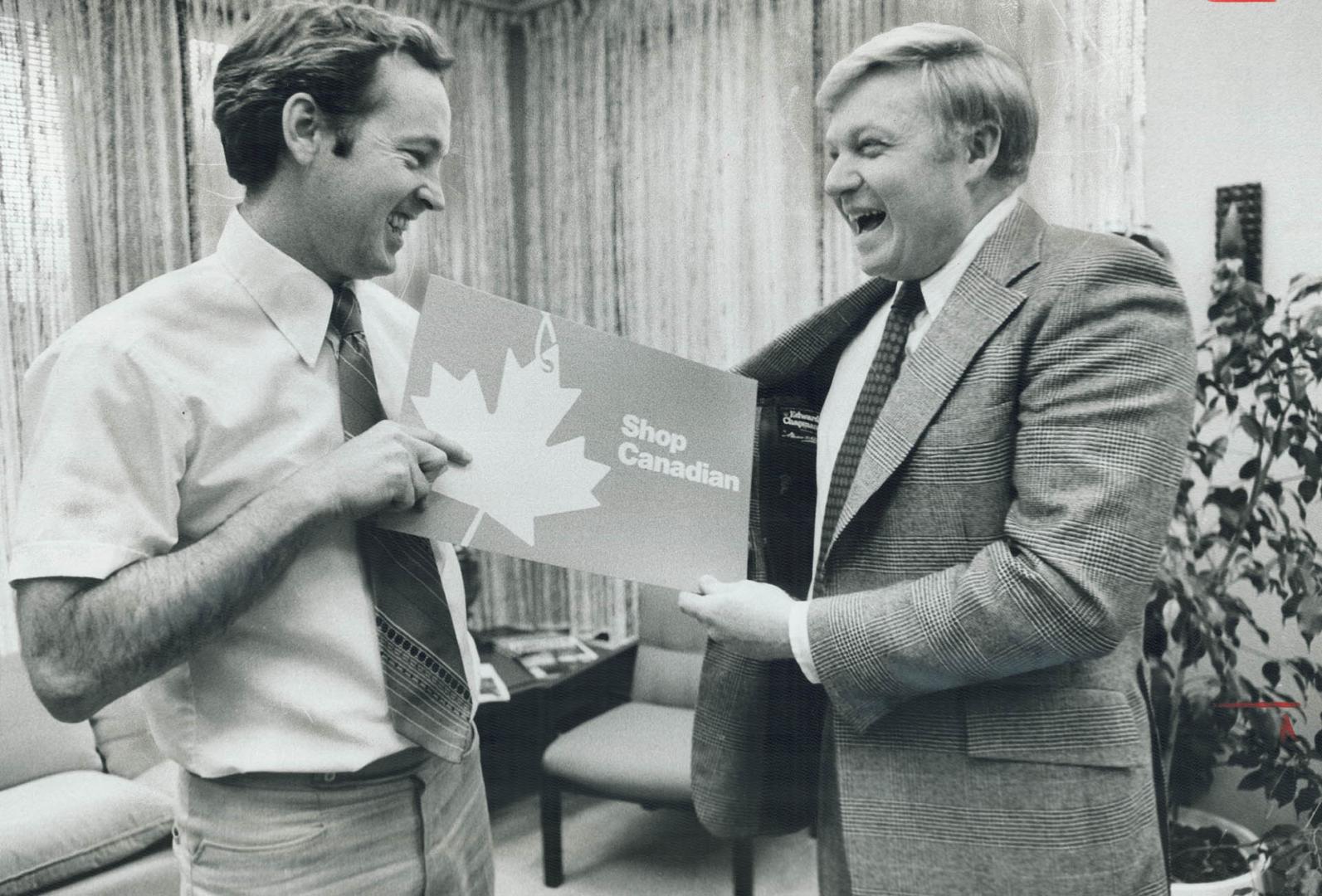 Yes, it's made in Canada: Industry's Dunc Allan (left) checks out label in Red Wilson's jacket