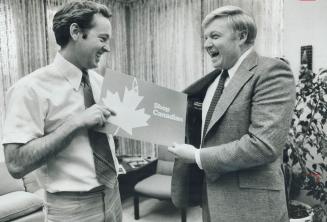 Yes, it's made in Canada: Industry's Dunc Allan (left) checks out label in Red Wilson's jacket