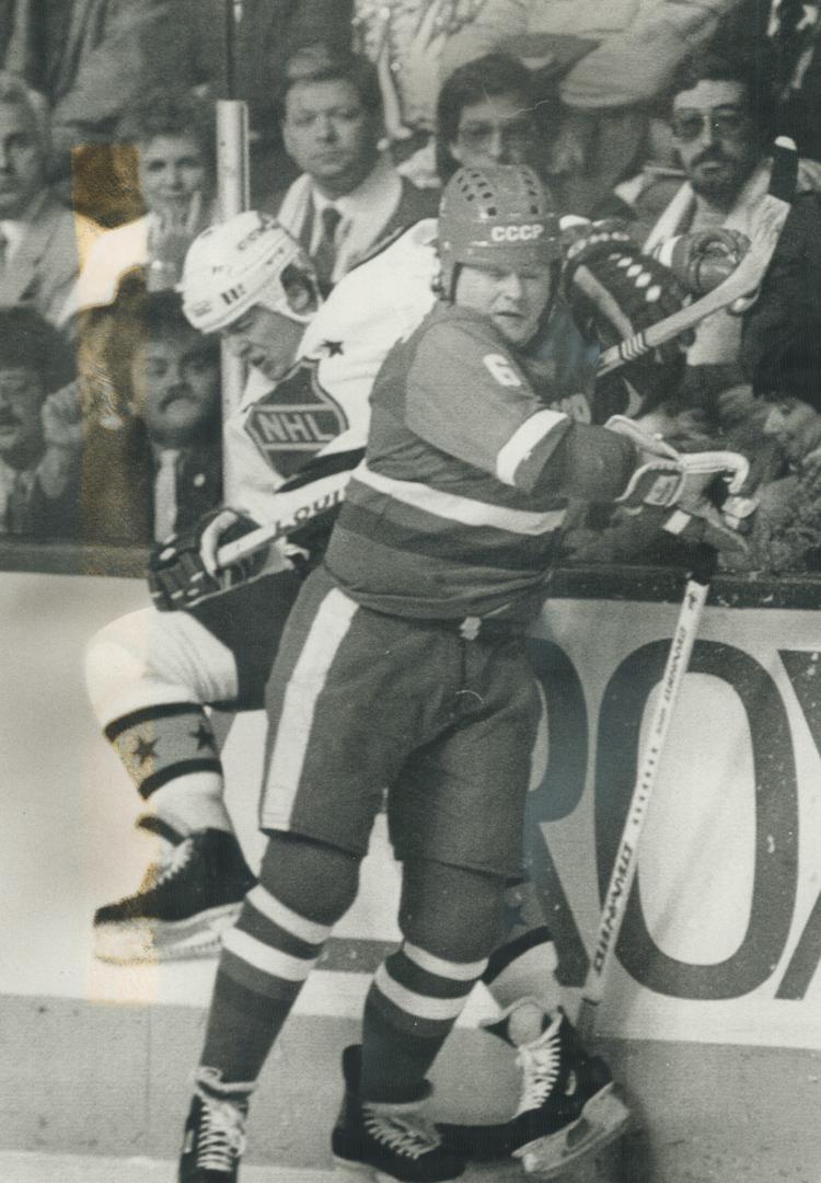 Stars have a board meeting. NHL star Claude Lemieux of the Montreal Canadiens is slammed into the boards by Soviet star Mikhail Tatarinov during early(...)