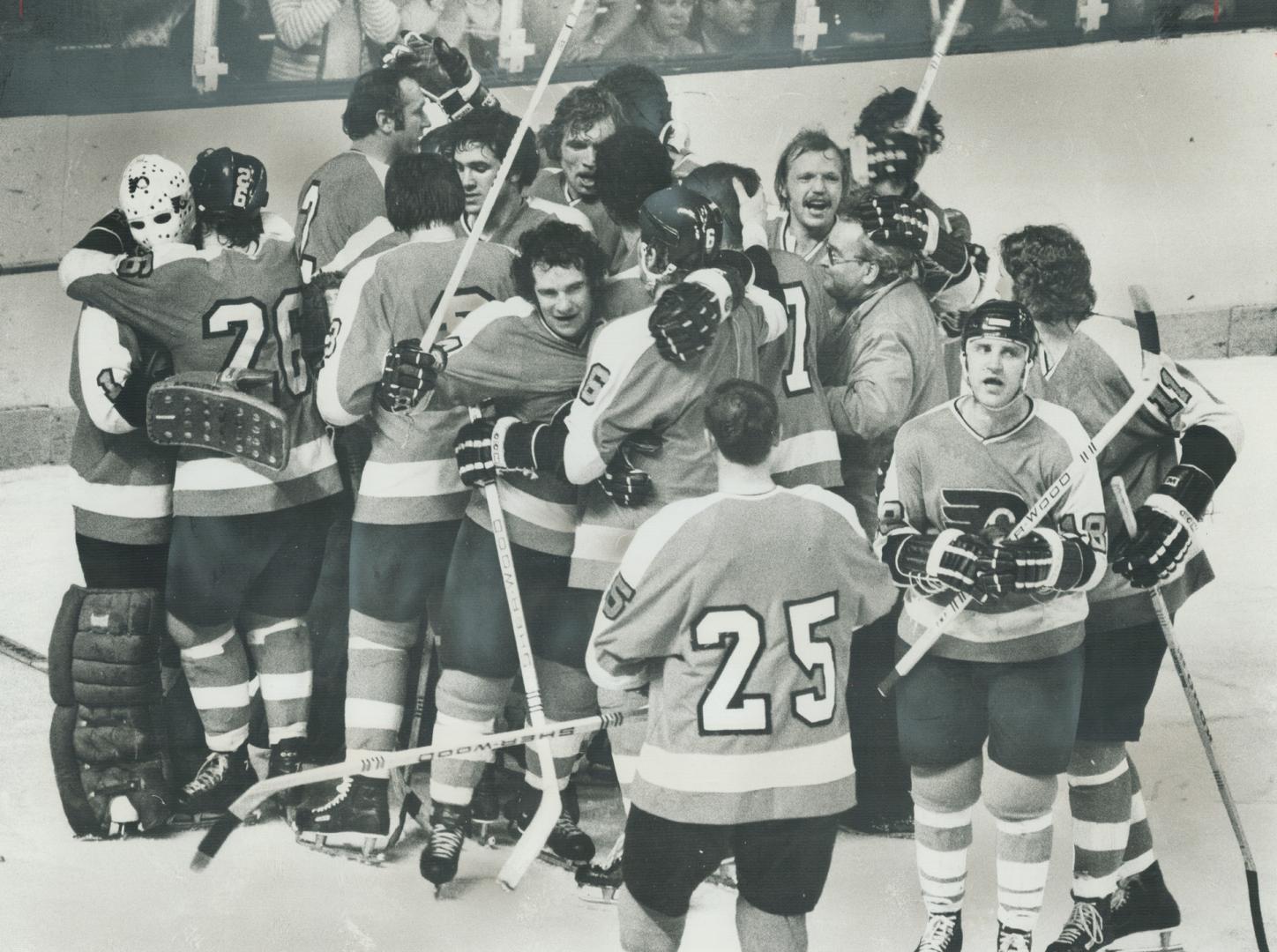 Mob scene by Philadelphia Flyers at the end of last night's game in Buffalo shows their ecstasy at winning second straight Stanley Cup championship. A(...)