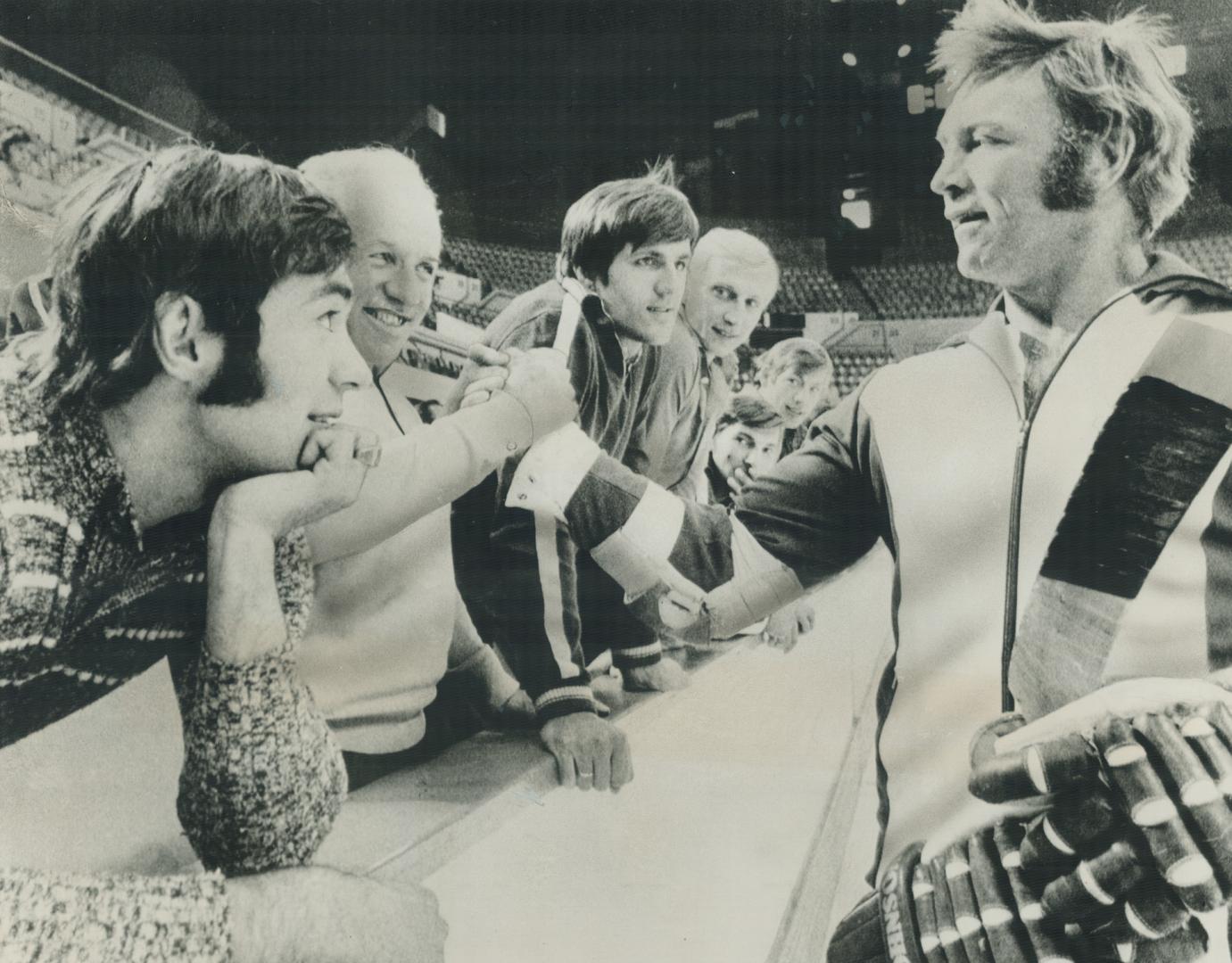 Sizing each other up. Hull takes time out from practice at the Quebec museum today to shake hands with Dr. Oleg Beloski, team doctor for the Soviet Union Nationals. [Incomplete]