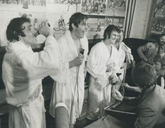 Left to Right Phil Esposito (drinking cola), Peter MaGarolich, Paul Henderson in press conference after Game in Toronto (Canada Uou)