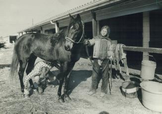 At left, Dan Giles and Tina DeJersey give Banzac a rubdown after workout