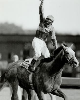 Double winner: Benburb, with Richard Dos Ramos up, is Canada's horse of year and Star photographer Jeff Goode won a Sovereign Award for this picture