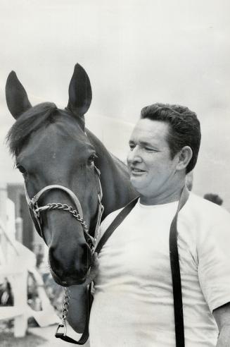 Sir Dalrae, being held by groom Dean Thornton at Greenwood, is latest superstar of harness racing