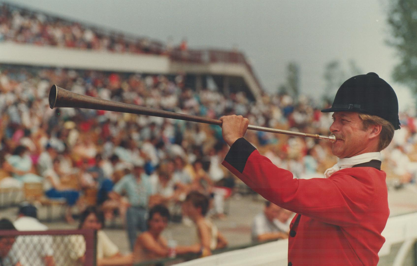 Call to the post: Bugler Jim Ahrens calls the horses to the post for yesterday's 129th running of the crown jewel of Canadian thoroughbred racing - The Queen's Plate