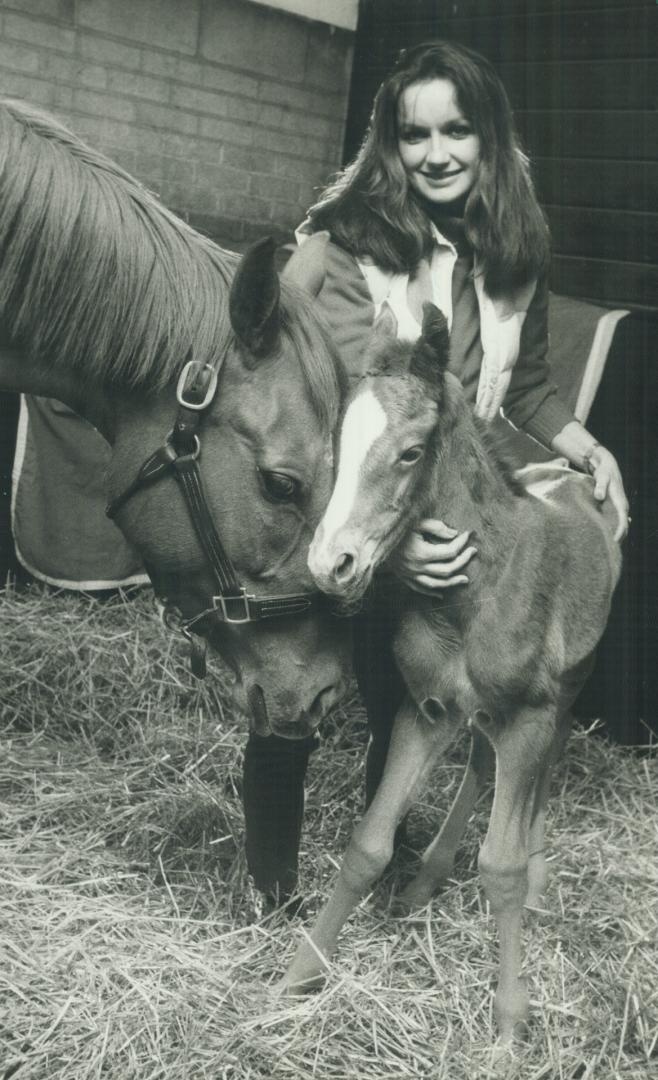 Meet Sunny's Halo's offspring. That's Sharon Dunn-Sikura, former CBC news anchor, with the first filly born in Canada sired by Kentucky Derby winner S(...)