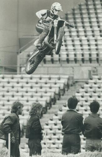 Sky rider. Iskevin Moore of Sarnia soars during practice yesterday for tonight's Supercross competition at Exhibition Stadium. The Stadium's field wil(...)