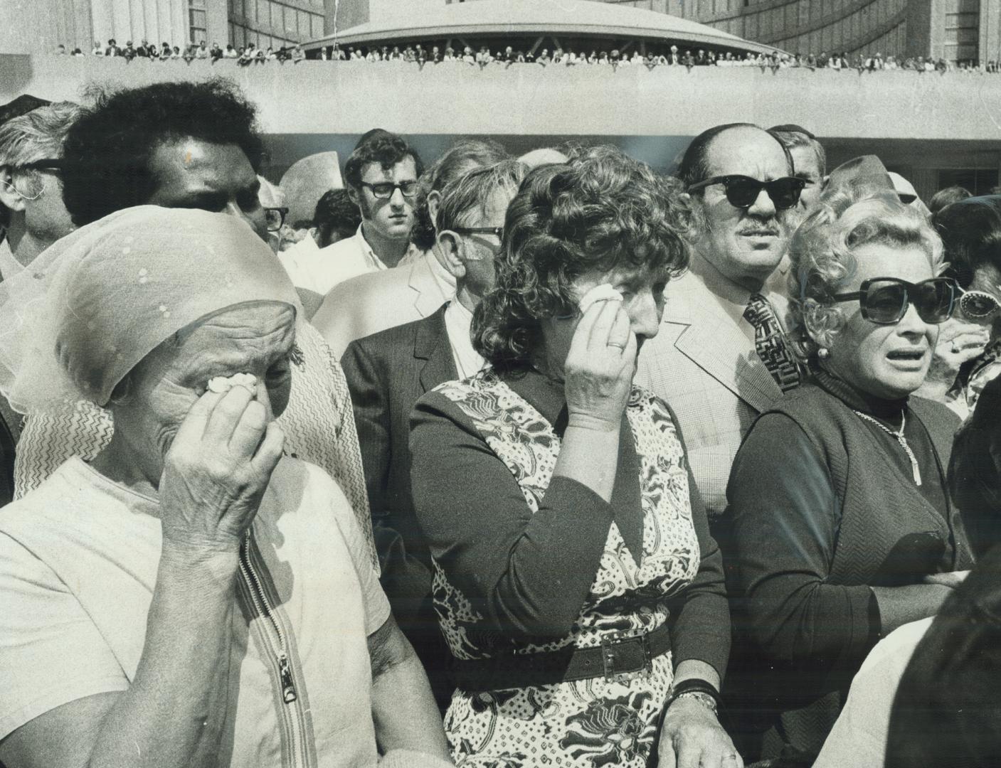 Women weep openly today at Nathan Phillips Square during memorial services to honor 11 Israeli Olympic athletes killed Tuesday in Munich by Arab terro(...)