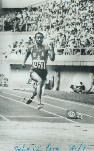 The longest jump. Using his arms and legs as propellers, Arnie Robinson knifes upward yesterday in gold medal-winning long jump. The American came dow(...)