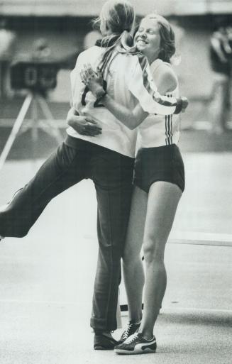 We're in! Louise Walker, left, and Julie White hug each other in congratulation for reaching the final of the Olympic high jump. They were the only two Canadian women to qualify for finals yesterday