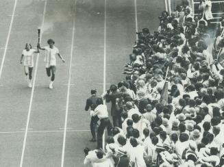 Olympic torch is carried in ceremony opening the Games