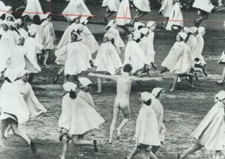 An unscheduled dancer joined the 500 Montreal schoolgirls who started closing night performance at Olympic Stadium