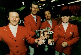 Riding high: Celebrating victory yesterday at Nations' Cup show-jumping competition are, from left, Erie Lamaze, Ian Millar, John Pearce and Beth Underhill