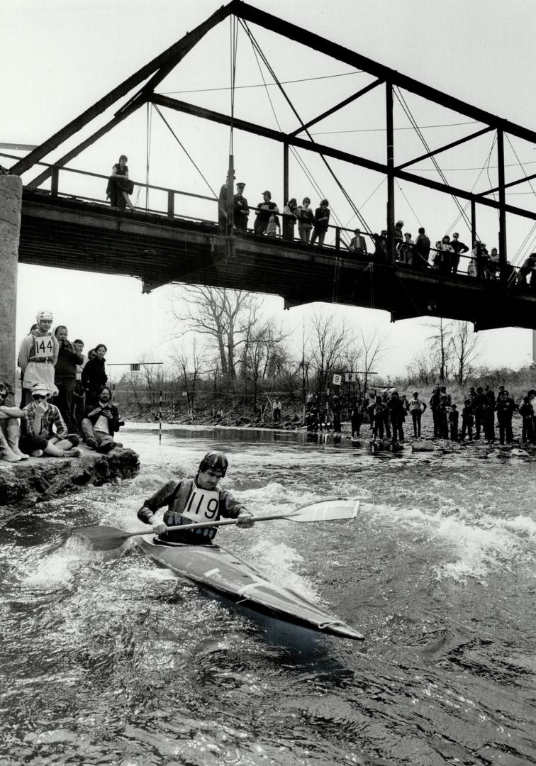 Onlookers watch Harold Van Winssen make tight turn