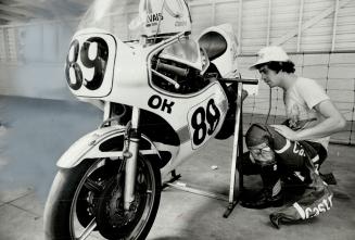 . . . and Toronto racer Steve Gervais gives his machine a close inspection in Mosport check-up