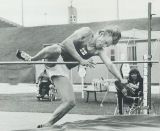 Blind Finnish athlete Martti Juntunen practises high jump at Olympiad