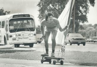 I'm winning Jess Martins, 24, roller-sails past the traffic on eastbound Lake Shore Blvd