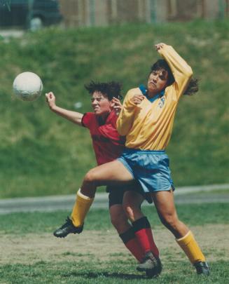 East York's Athena Gerochristodoulou, right, and a Malvern player battle for position during senior girls' TSSWAA soccer final yesterday. East York, u(...)