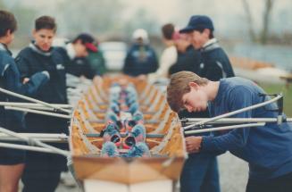 Crew members abandon their footwear on the dock near Cherry Beach before climbing aboard their craft, which comes equipped with permanently anchored shoes