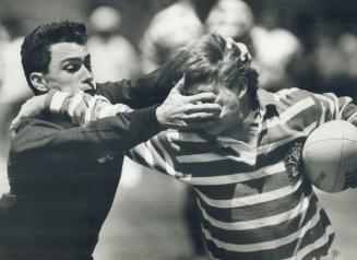 Rugby can be rugged, A defender from Nelson Boylen Secondary School Bullets left, determined to stop the enemy from going any farther in a North York (...)