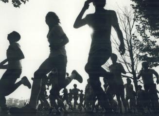 Me and my shadows at high park, Outlined against the autumn sky, these leaders of the pack are off and running in the City of Toronto midget boys' hig(...)