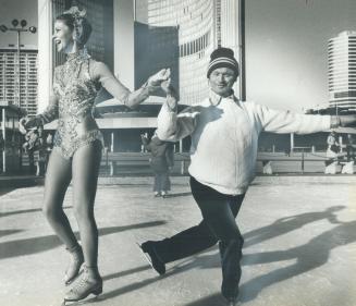 Barbara Berezowski (a former Miss Toronto) tried out her Ice Follies stakes on the ice at the rink in front of City Hall