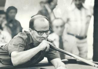 Concentration. John Dillon of Toronto is picture of concentration as he lines up shot during yesterday's play in CNE snooker tournament. Dillon won th(...)