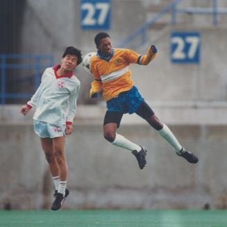 East York's George Antic (right) and Tonny Nguyen from Eastern Commerce almost had a head-on collision in yesterday's Toronto Secondary Schools Athlet(...)