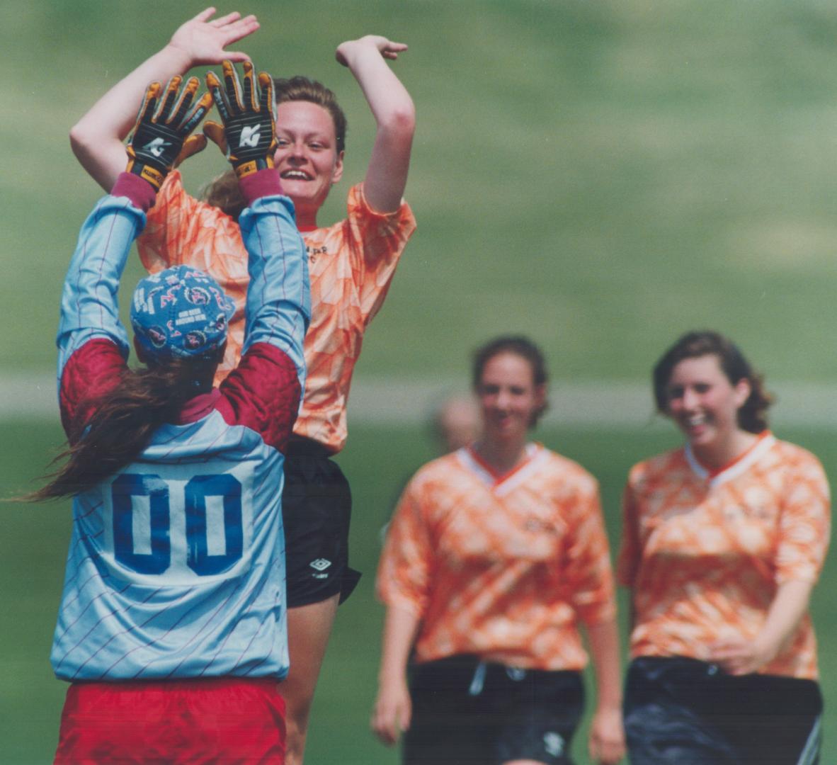 They're slap happy, April Taylor of North Park (Brantford) celebrates her goal with 'keeper Tammy Smith in a 6-0 rout over Branksome Hall in OFSAA soccer