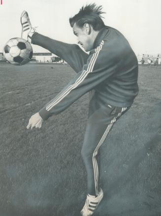 Scoring leader of the national soccer league, Anders Yrfelt shows how to bring down a high pass during practice