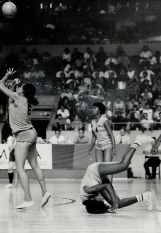 Crash Dive . . ., Mercedes Torriente Acea, captain of Cuban women's volleyball team, had a headache after this crash to floor during heated action in (...)