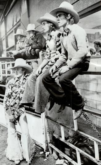 While a bunch of the boys looked on, 22-year-old Gary Doner is thrown for a few lumps and bruises by an aptly named bull called Watergate. He was competing at Ontario Rodeo Association Finals