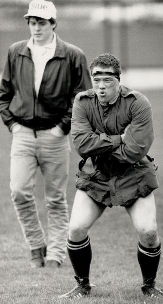 Daniel Van der Groot of Toronto Lions tries to stay warm on the sidelines during a rugby match at Coronation Park