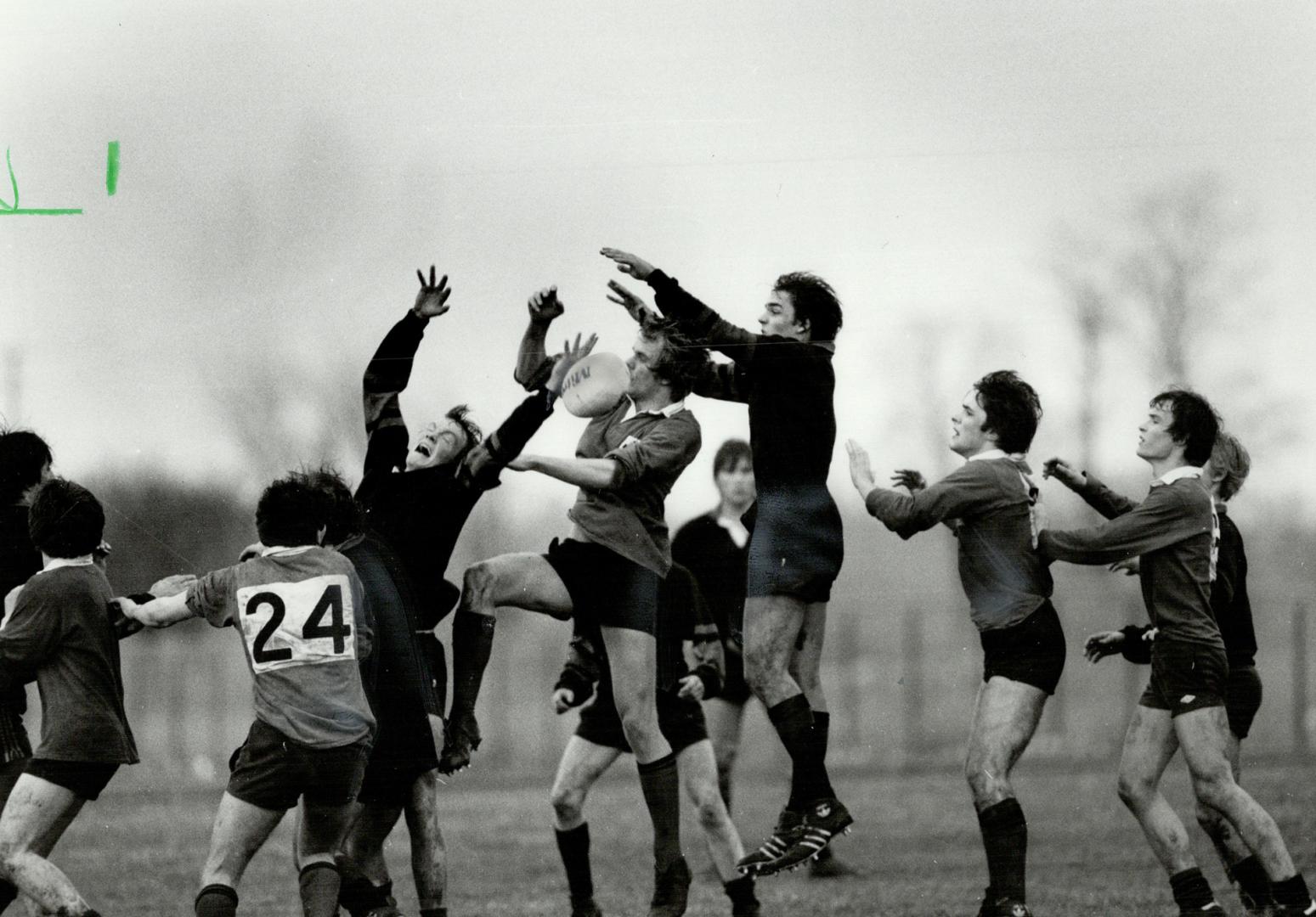 Roughing it up: Players from Brecon College in Wales (light tops) play Dunbarton High School rugby team on return of visit