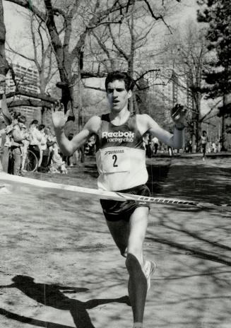 Victory: Paul McCloy of St. John's, Nfld., raises his arms in victory as he crosses the finish line in the eight-kilometre Brooks Spring Run-off yeste(...)