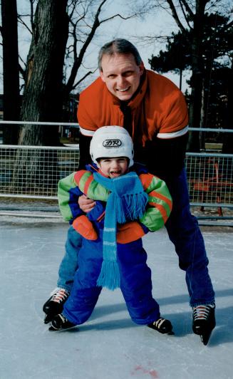 Helping hand: Derek Dishart, 3, gets support from dad, Kim, to get around at Gage Park