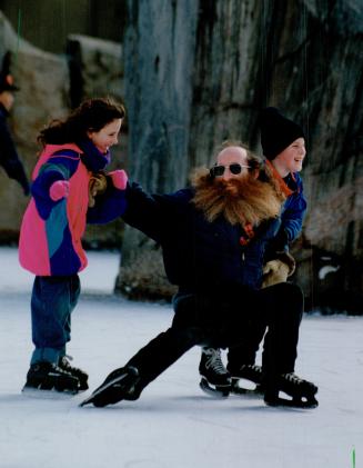 A wobbly Roy Harris, who's been on skates only a few times, gets a few technical pointers from his children at the skating rink at Ryerson Polytechnic(...)