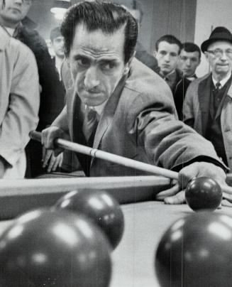 Montreal's Eddy Agha, lining up shot prior to play, won first four games of Canadian pro snooker championship semi-final last night at Derby Billiards