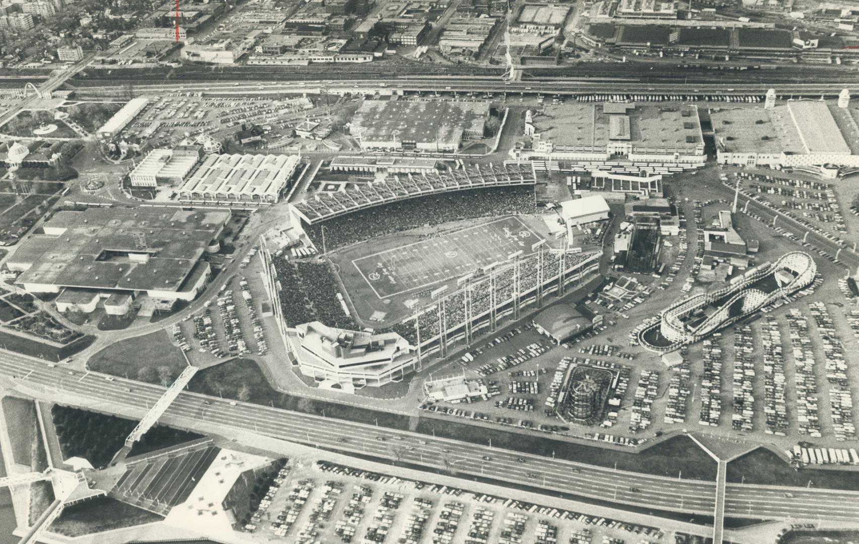 Aerial view of Exhibition Stidium and parking areas, looking north from Ontario Place, shows crowd of 54,386 fans, fewer than 30 were hauled off in paddy wagons