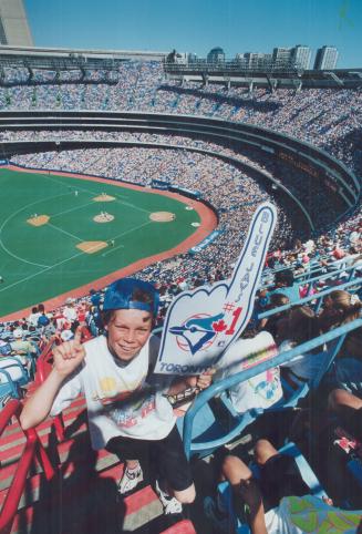 Charles Gaulton celebrates his 12th birthday yesterday by attending the Blue Jays game at the SkyDome