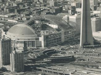 Taking shape: The first of three roof panels to be moved covers the south end of SkyDome, following a successful and unexpectedly quiet trip from the north end yesterday